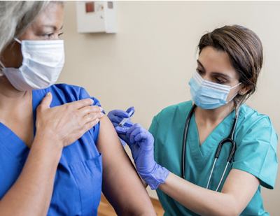 provider giving vaccine to patient