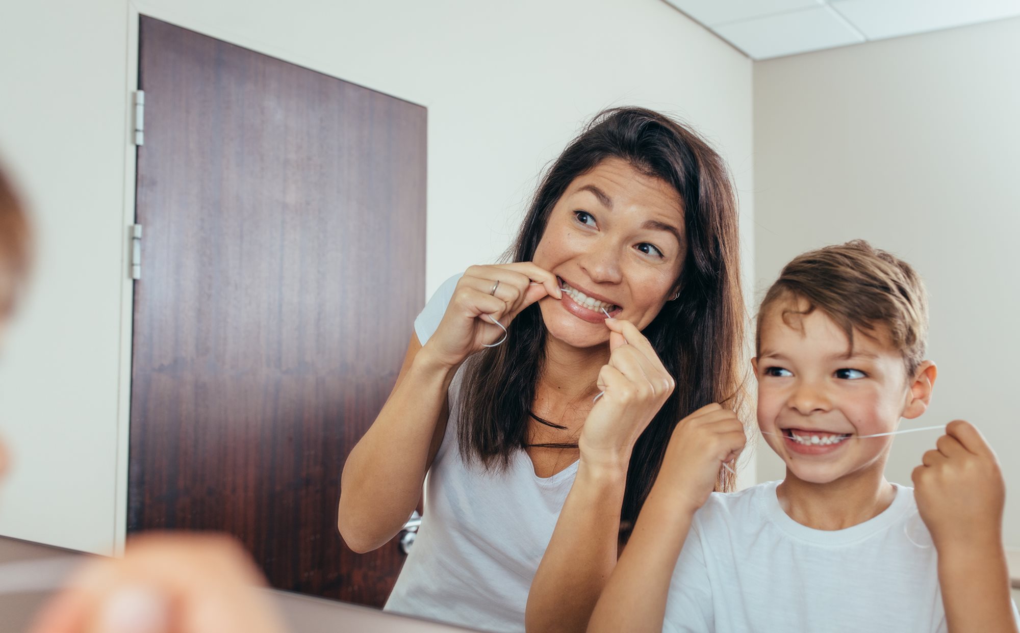 Parent and child flossing